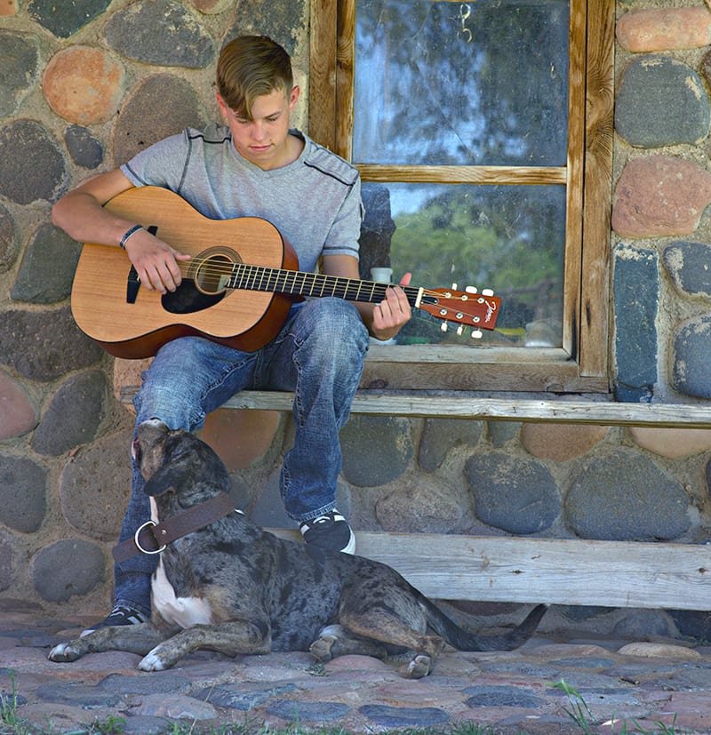 boy-with-dog The Curicyn Difference: Boy Playing Guitar With Dog