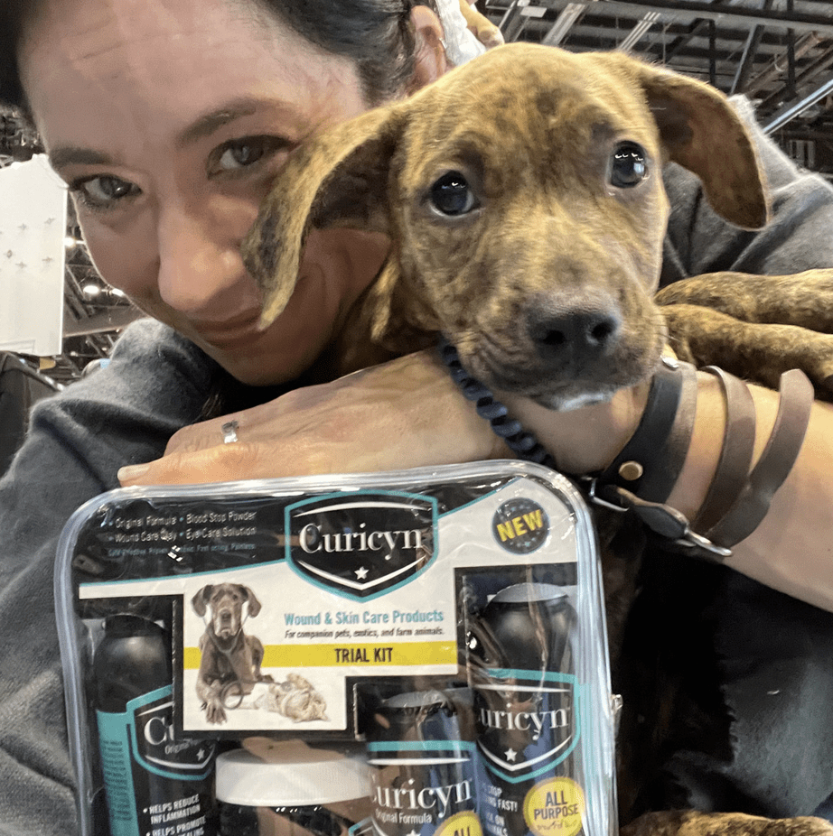 Curicyn helps adopt puppy from The Pixel Fund pet rescue at Global Pet Expo